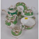 A Victorian tea service having a white ground with green and gilt border together with an additional