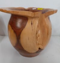 A Terry Harvey hand turned yew planter, label and carved insignia to base, 28cm High x 15cm internal