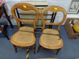 A Victorian mahogany towel rail, a pair of cane seated bedroom chairs and a horn handled walking