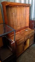 A Stewart Linford burr yew dresser with two height adjustable shelves and six short drawers, over