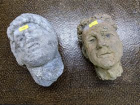 A carved quartz style head and a pottery head Location:
