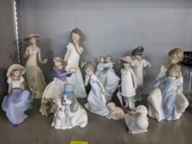 A collection of Nao porcelain figures and animal models to include a Wedding couple and one of a