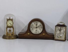 An Edwardian Napoleon hat mantle clock having inlaid detail, together with an anniversary clock