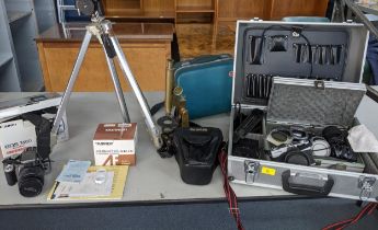 A mixed lot of camera equipment to include a camera case containing a Pentax A Sahi K C1000 and