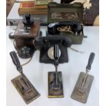 Three telephones to include a Rotary dial and a military telephone set H MK111 and three cast iron