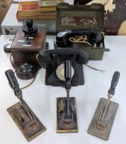 Three telephones to include a Rotary dial and a military telephone set H MK111 and three cast iron