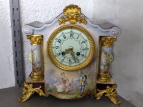 An early 20th century French porcelain mantel clock having gilt metal mounts, and an 8-day