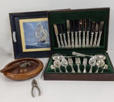 A canteen of cutlery for six, together with a nut cracker bowl and hammer and tray depicting a ship,