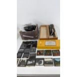 A quantity of photographic slides in monochrome and colour depicting cartoons and photographic