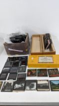 A quantity of photographic slides in monochrome and colour depicting cartoons and photographic