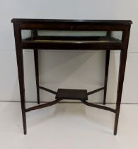 An early 20th century mahogany display table on square legs, Location: