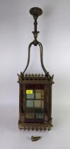 An early 20th century gilt brass lantern with stained glass panels, Location: