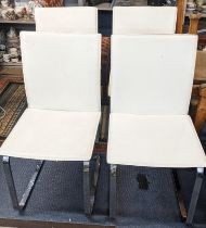 A set of eight modern white leather dining chairs on cantilevered chrome supports, attributed to