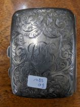 A George V silver cigarette case, engraved scroll leaf decoration, initials to shield shaped