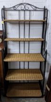 A contemporary wrought iron framed five-shelf folding shelf unit with cane shelves 184cm x 80.5cm