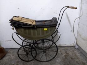 A Sillers vintage pram, painted wooden carriage, black leather interior and hood, on a wrought