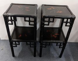 A pair of reproduction Japanned black lacquered two tier occasional tables having painted top and