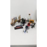 A mixed lot to include a Mamod SR1A toy tractor, a small model of a ship in a bottle sailing boats