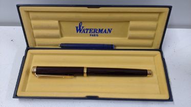 A boxed Waterman fountain pen with an Ideal 18k gold nib, together with mixed books to include a set