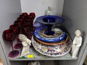 Ceramics and glassware to include, three Lladro figures, eleven red wine glasses, a blue glass
