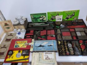 Early 20th century toys and cigarette cards to include five trays of Meccano construction pieces