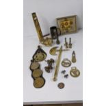 A mixed lot to include cap badges and re-strikes, a shot gun casing, horse brass a white metal badge