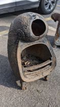 A 19th century French cast iron wood burning stove having a nautical design and on castors Location: