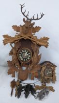 Two mid 20th century Black Forest carved cuckoo clocks, Location: