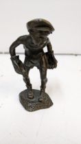 A 1930's cast bronze figure of a boy wearing a cap and oversized gloves, stamped H M Mop, 13cm h