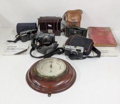 A mixed lot to include an Olympus Trip 35 and others, along with a wall hanging wheel barometer