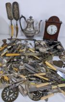 A mixed lot to include a 19th century mantle clock, silver plated cutlery, horse brasses, a silver