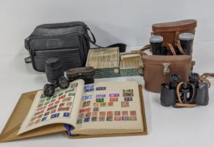 A mixed lot to include a stamp album part filled, cigarette cards, a Sigma 70-120mm camera lens,