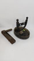 A 19th century cast iron boot scraper and a vintage rattle, Location:
