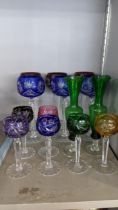 Bohemian Hock glasses with three red and three blue cut bowls, with tapering stems and flat feet,