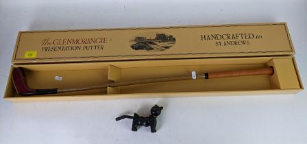 The Glenmorangie presentation putter in box, along with an articulated wooden black cat toy,