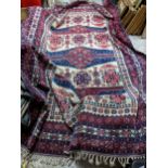 A Turkish Kazakh woollen hand woven carpet in reds, blue and ivory colours, all over geometric and