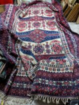 A Turkish Kazakh woollen hand woven carpet in reds, blue and ivory colours, all over geometric and