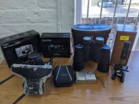 A selection of cameras to include a Minolta xG2 film camera, digital camera, Regent 7 x 50