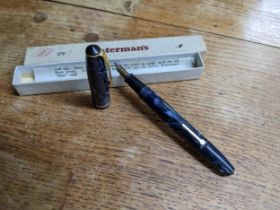 A Conway Stewart 15 fountain pen, in a blue variegated casing, 14ct gold nib, in a Waterman's pen