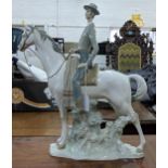 A Lladro figure of an elegant man in smart dress on horseback, Location: