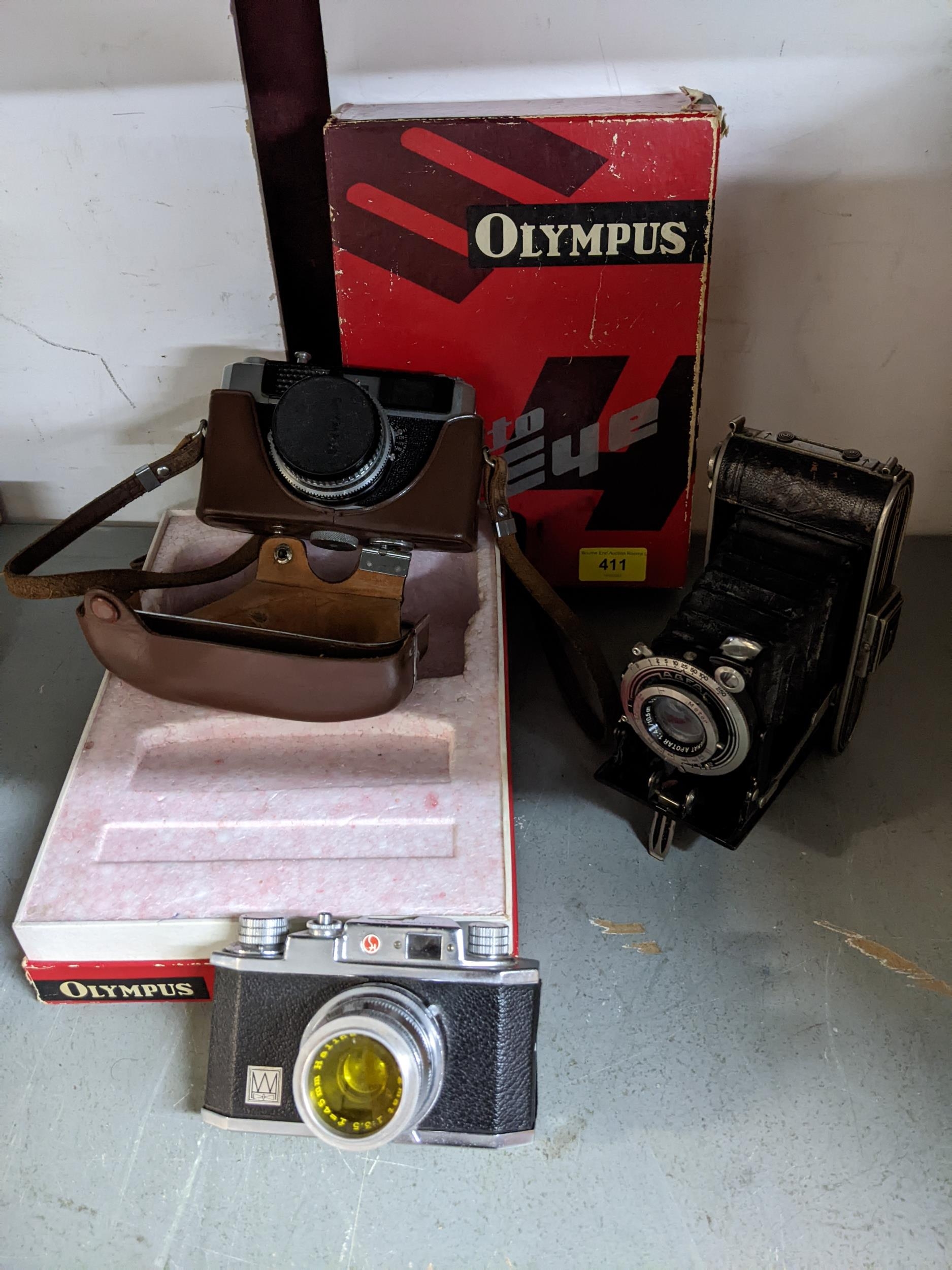 Vintage film cameras to include an Olympus Auto Eye camera with D Zuiko f4.5cm lens, in leather