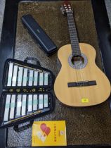 A Jose Ferrer classical acoustic guitar, a cased Yamaha flute and a Japanese xylophone Location: