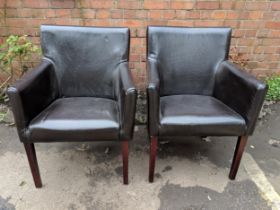 A pair of modern brown leather upholstered armchairs, Location: