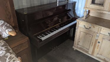 A late 20th century Steinbach mahogany cased upright piano, with Harrods label, ref 76162, the