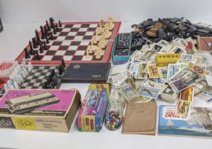 A mixed lot to include a small marble chess board (three pieces missing), Dominoes, a Stylophone