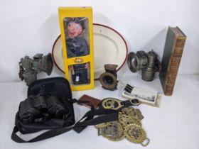 A mixed lot to include a Pelham puppet, china, horse brasses, binoculars, postcards, book, bike