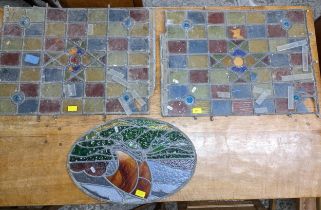 Two 19th century stained glass window panels and a later oval stained glass panel Location: