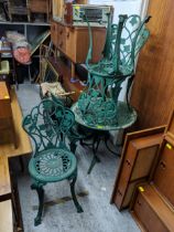 A late 20th century green painted, cast metal garden table and a set of four chairs, Location: