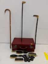 Three walking sticks, a red leather suitcase and ebony dressing table items, Location: