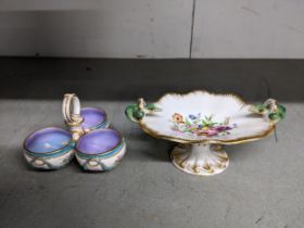 A 19th century footed porcelain dish decorated with a coastal flower spray border, with a gilt